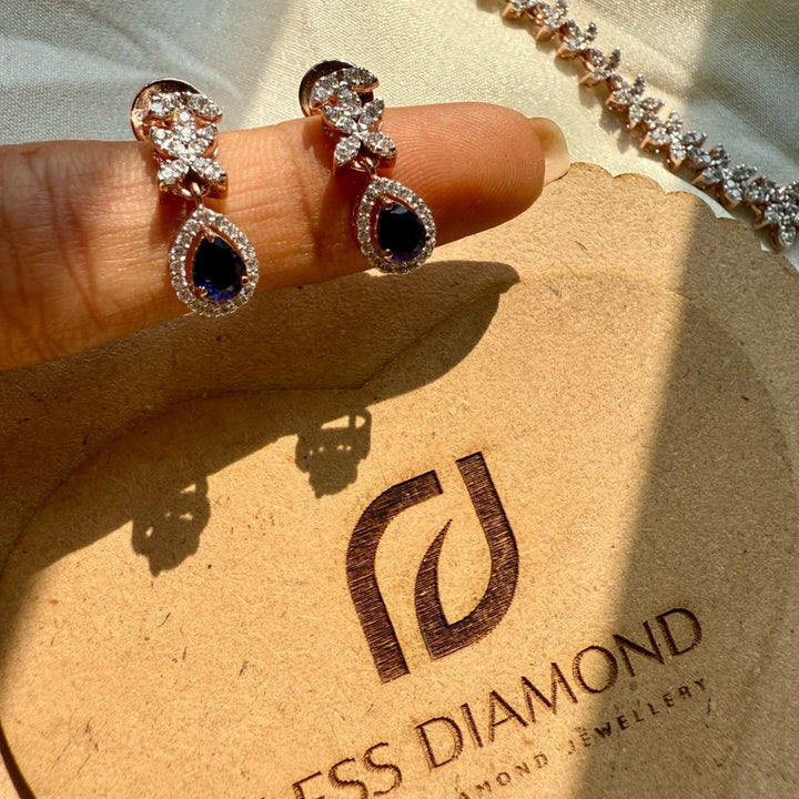 Dazzling Diamond Necklace Set With Blue Pear Gem