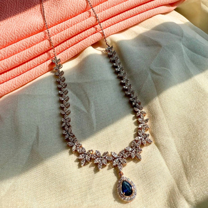 Dazzling Diamond Necklace Set With Blue Pear Gem