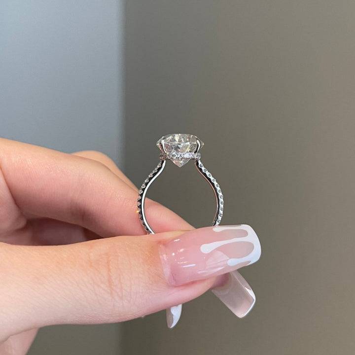 Oval hidden halo diamond ring