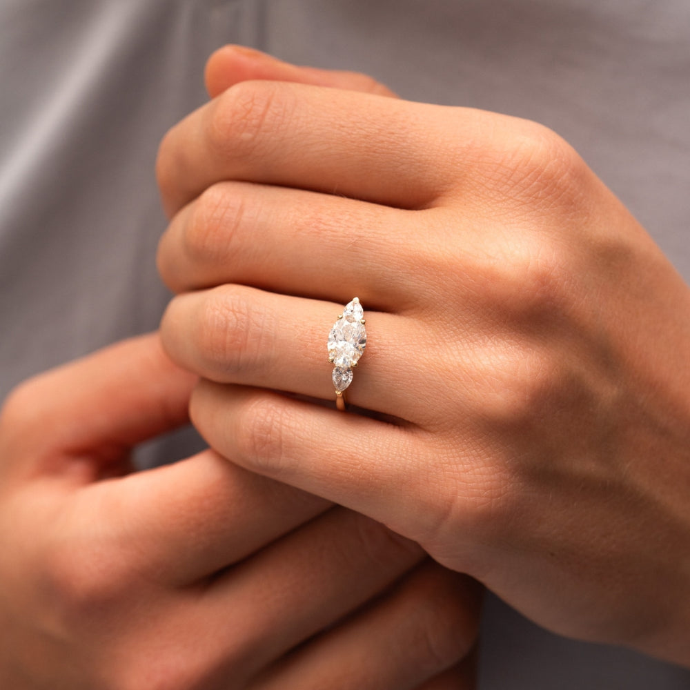 pear three stone diamond ring