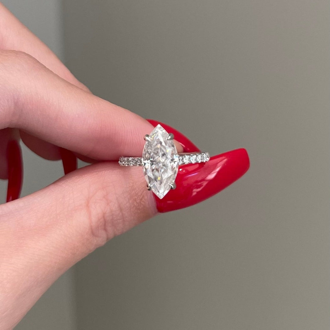 Marquise center stone ring with round side stones