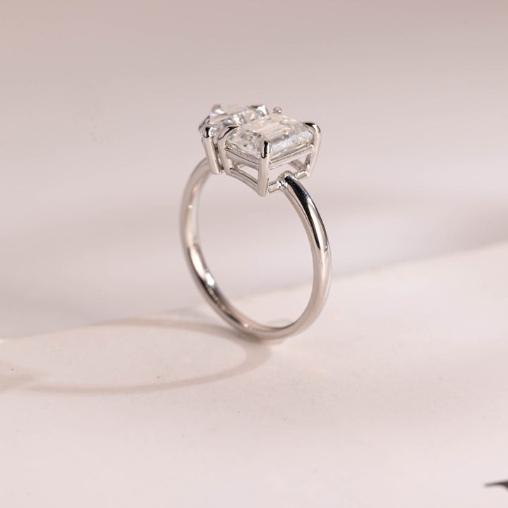 Pear diamond ring emerald side stones