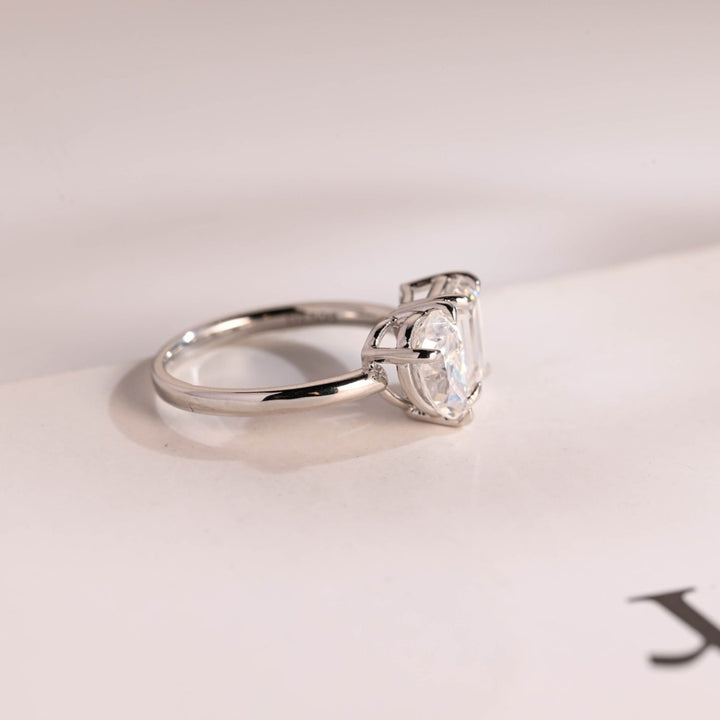 Pear and emerald two stone ring
