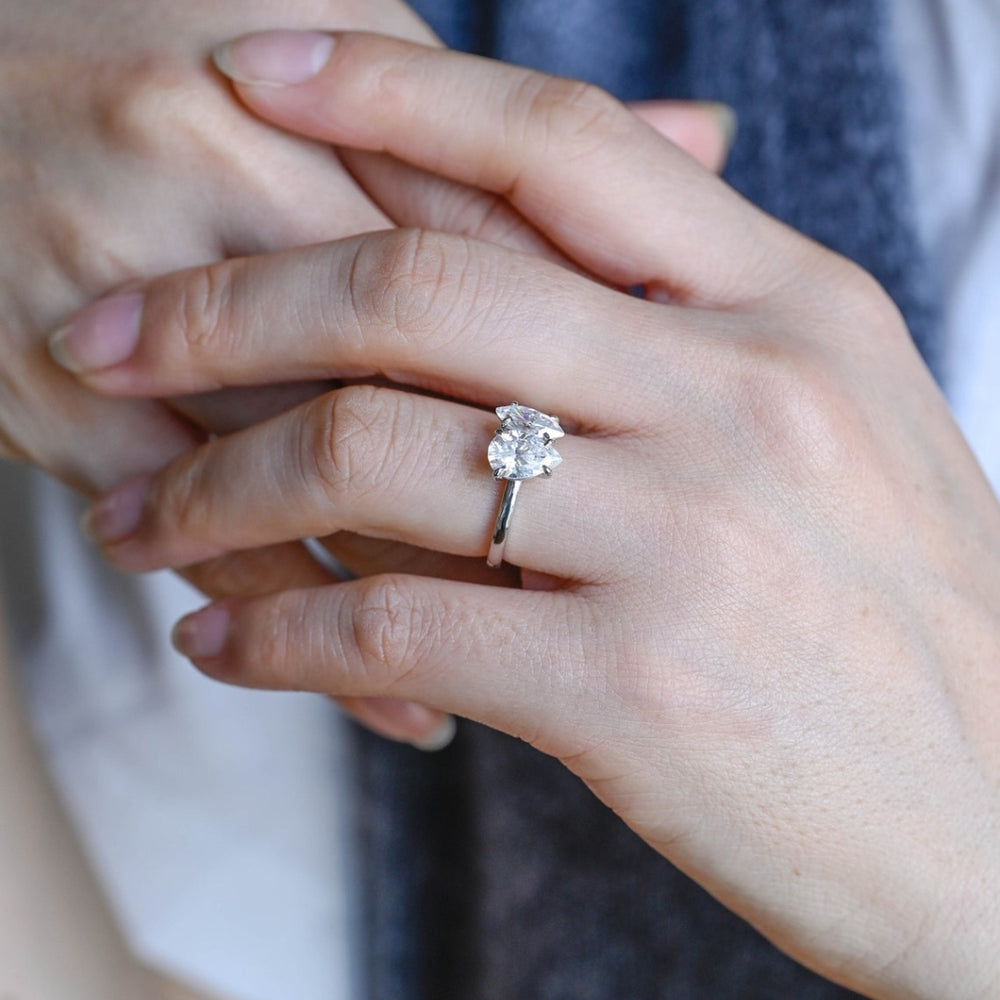 Marquise diamond ring with pear side stones