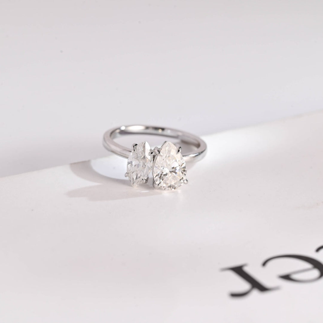 Marquise cut engagement ring with pear side stones