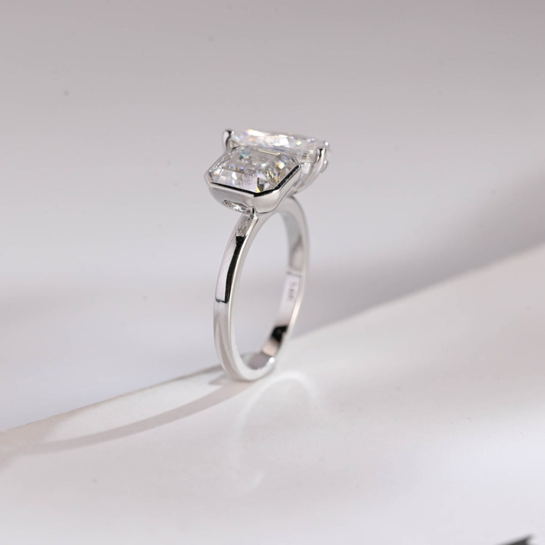 Asscher cut center stone with pear side diamond ring