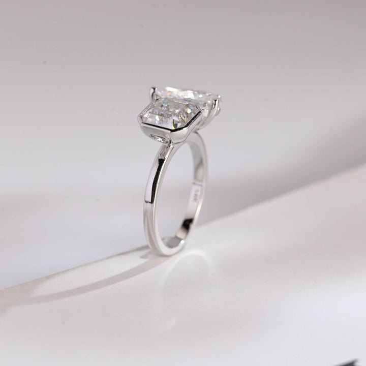 Asscher cut center stone with pear side diamond ring