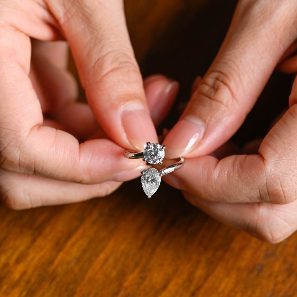Floating pear diamond ring