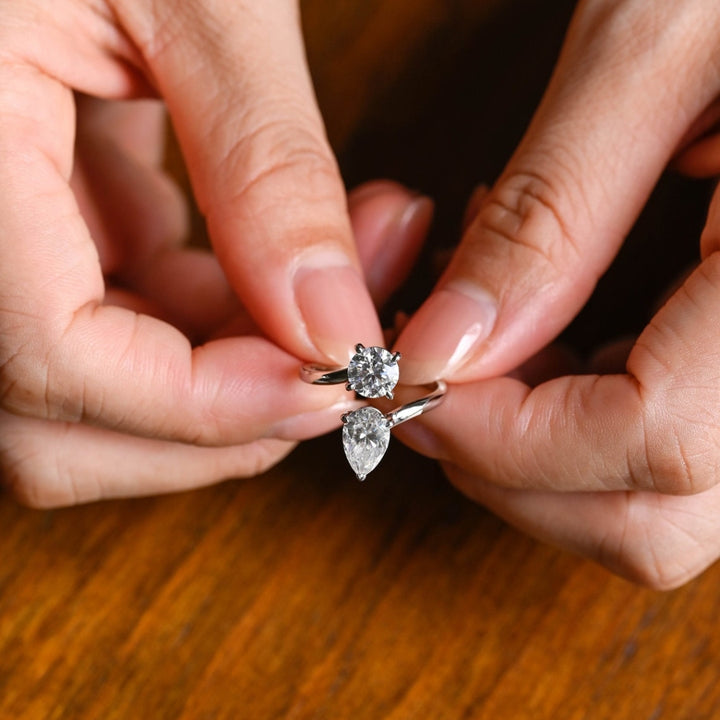 Floating pear diamond ring