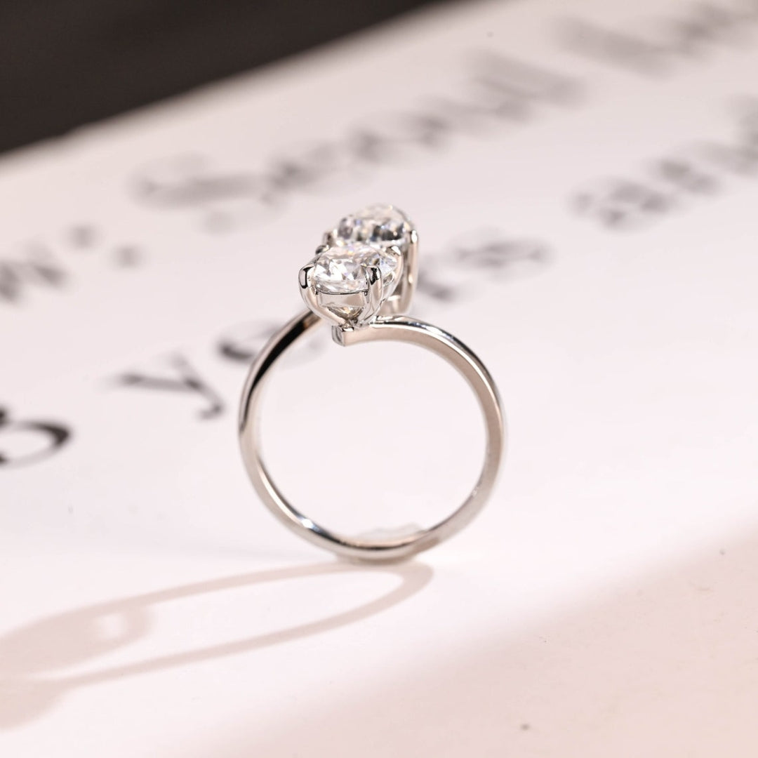 Pear and round diamond ring