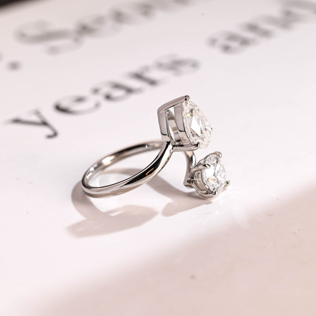 Pear and round diamond bypass ring