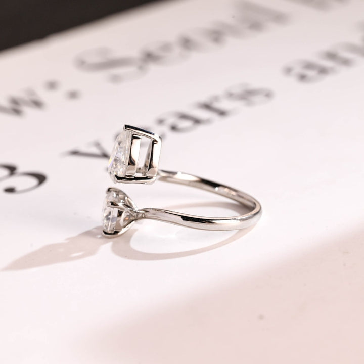 Modern pear and round diamond ring