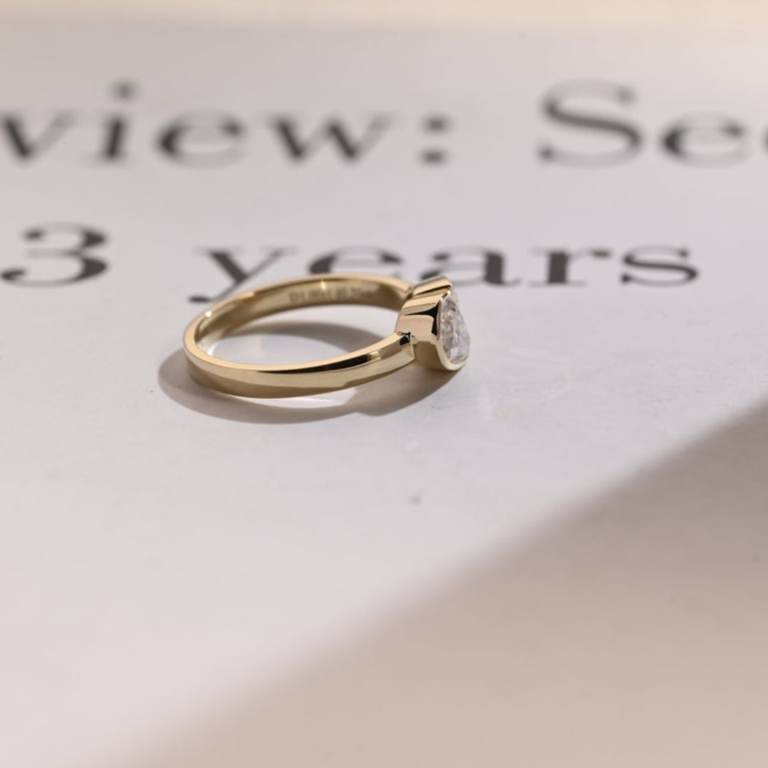 Pear shaped diamond bypass ring