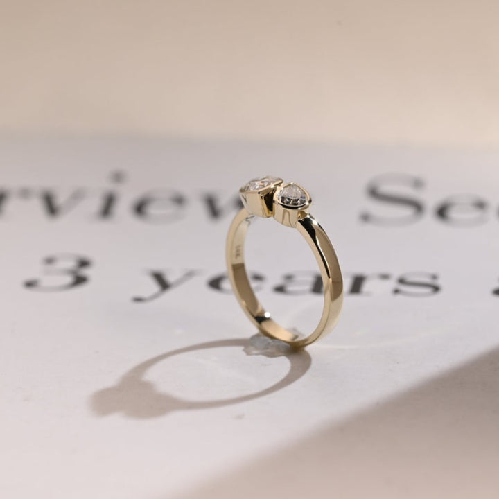 Floating pear diamond ring