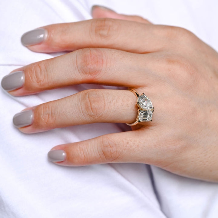 Moissanite pear with emerald diamond ring
