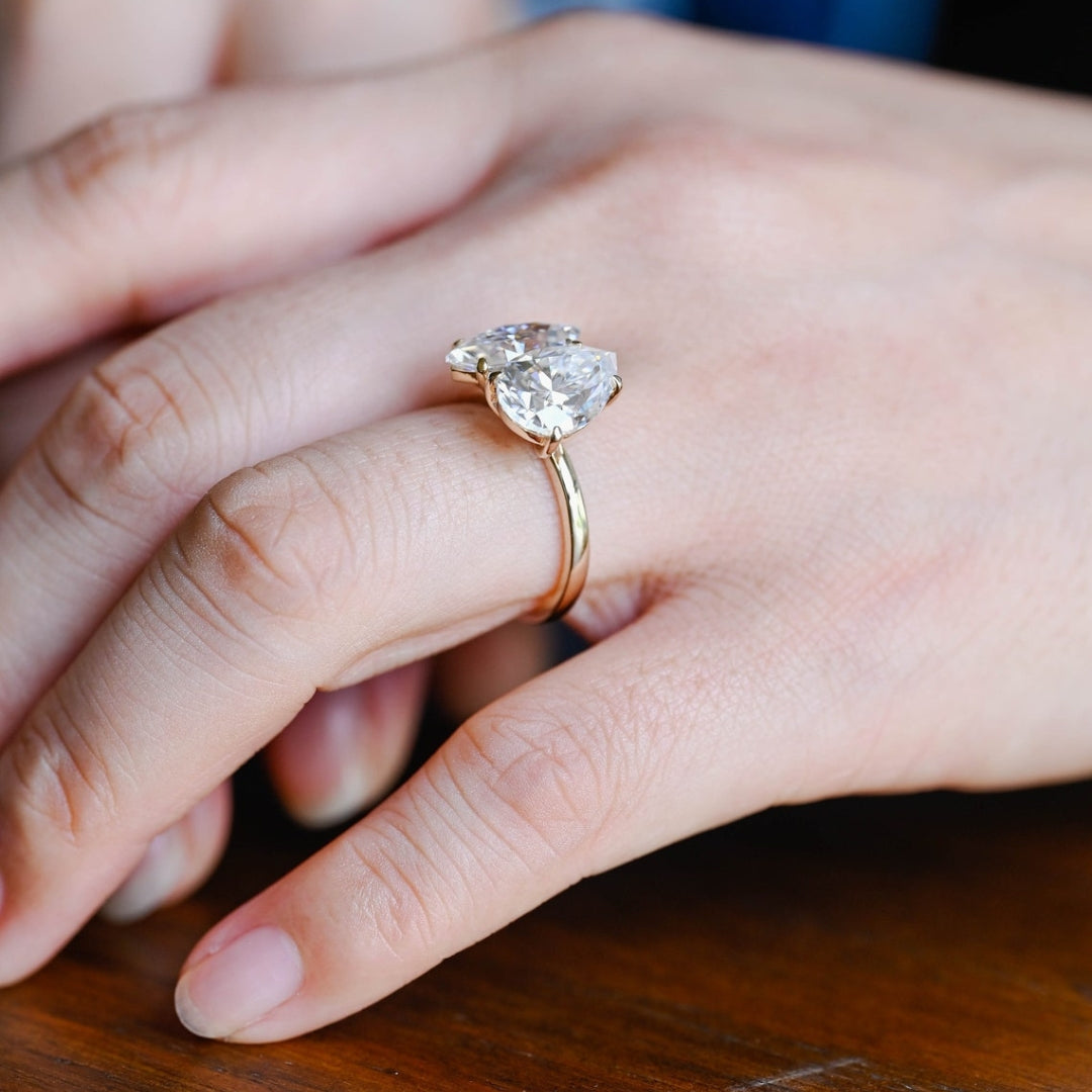 Marquise center stone ring with pear side diamond ring