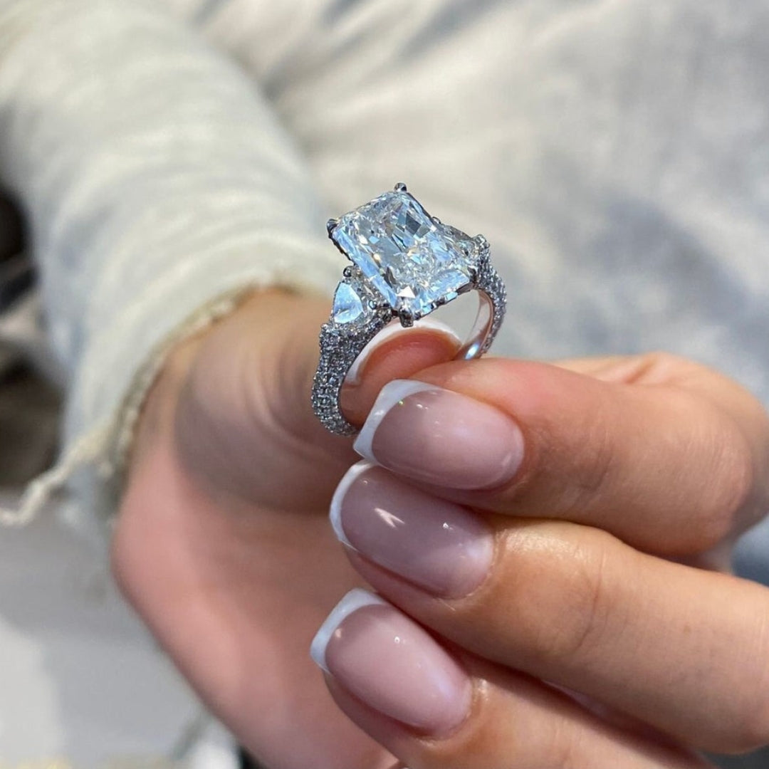 Radiant hidden halo half moon setting ring