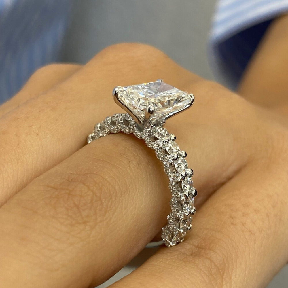 Radiant diamond ring with round side diamond