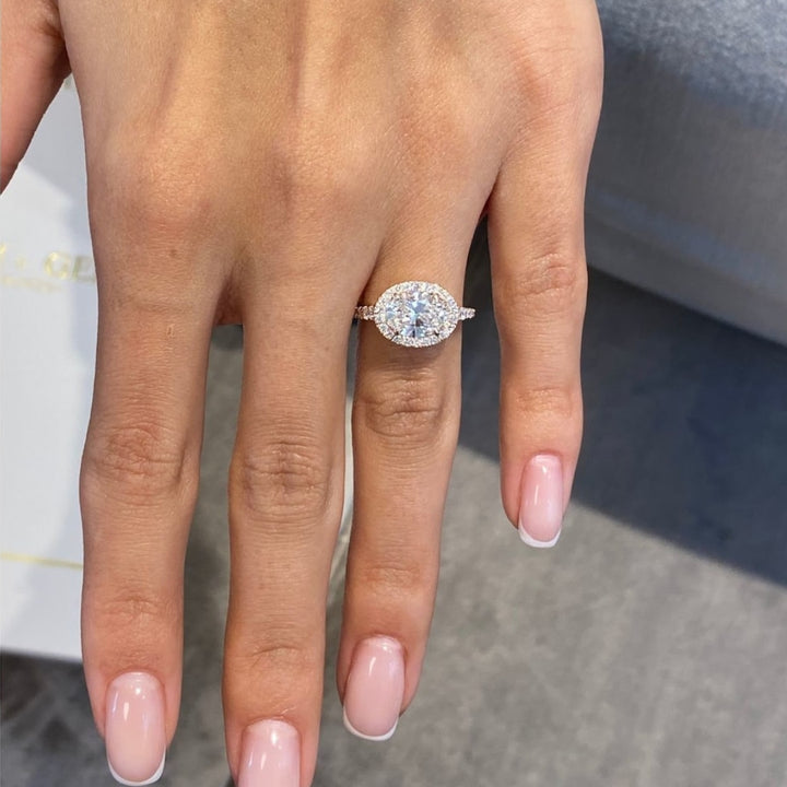 Oval diamond ring hidden halo setting