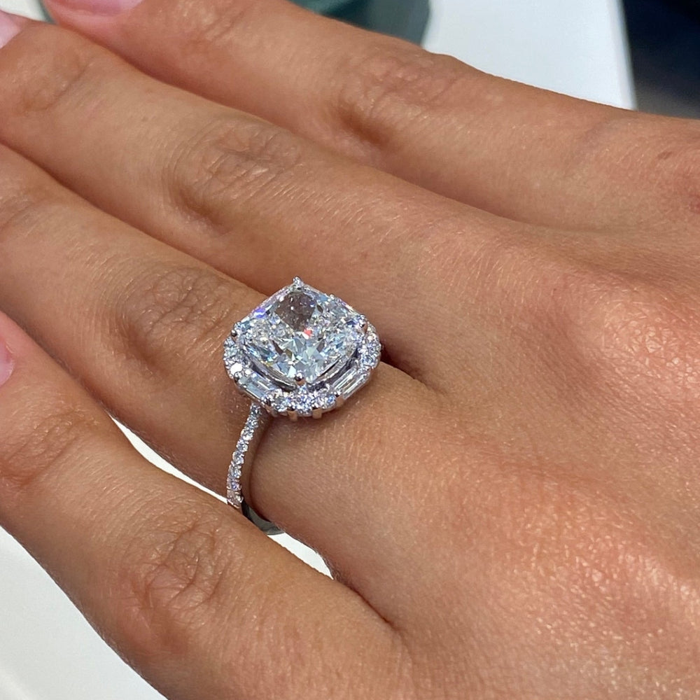 Cushion halo ring with baguette and round side stones