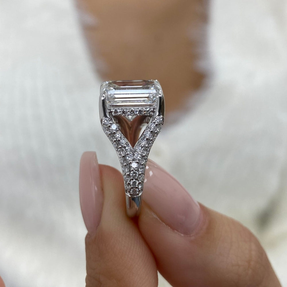 Emerald engagement ring hidden halo