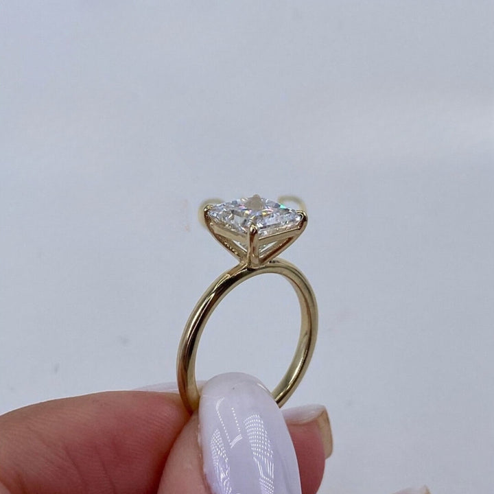 Princess solitaire ring yellow gold