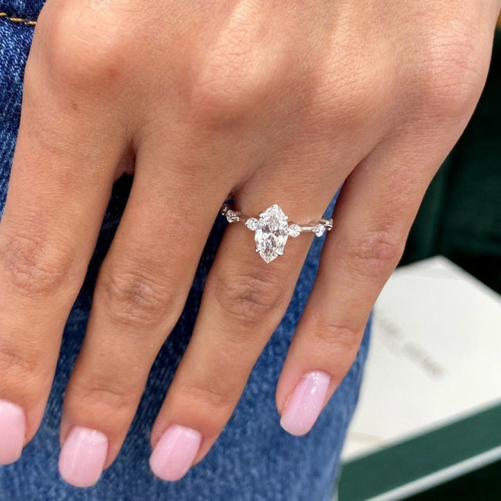 Marquise with side diamond ring