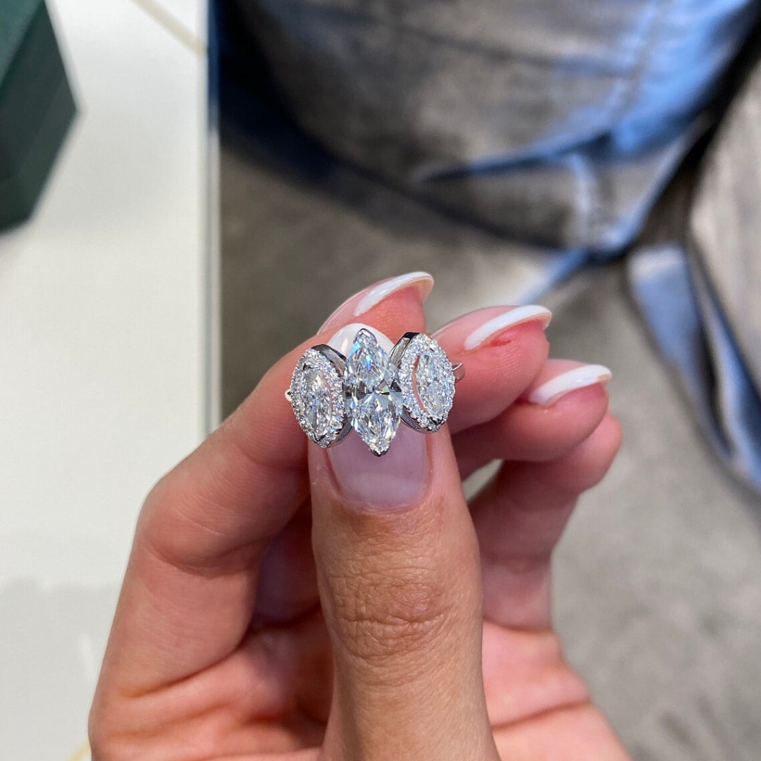 Three stone ring with marquise center