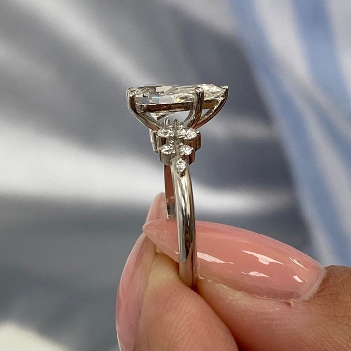 Pear diamond with side stone ring