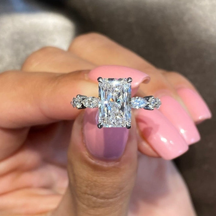 Radiant diamond ring with side stones