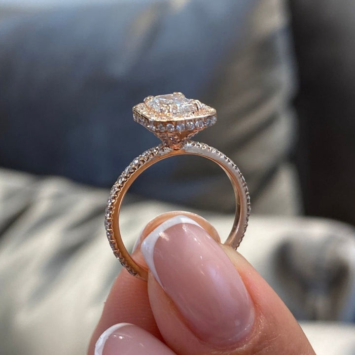 Emerald center stone halo ring