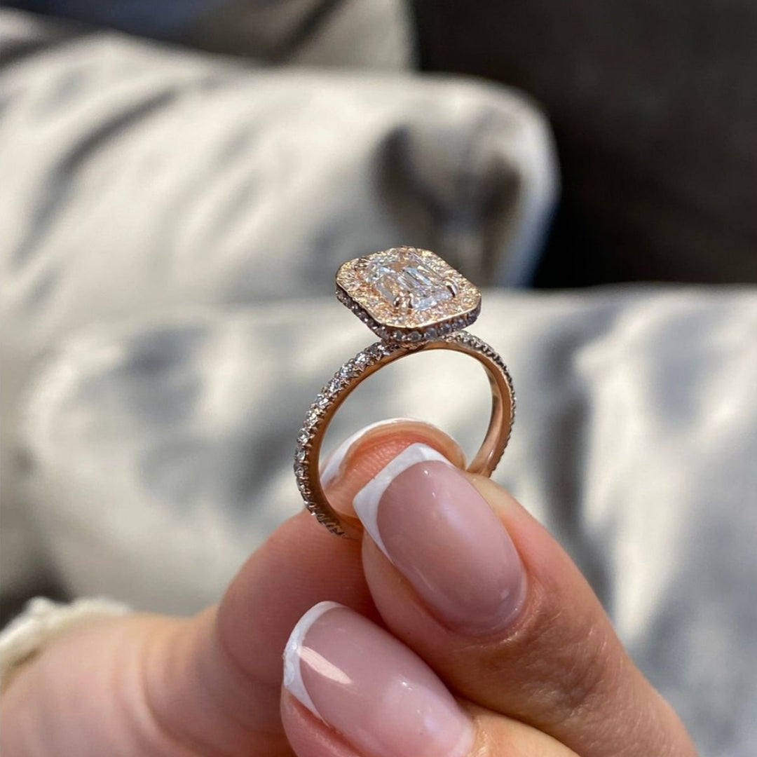 Emerald engagement ring halo