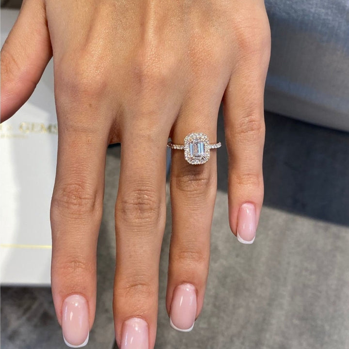 Emerald diamond ring with halo