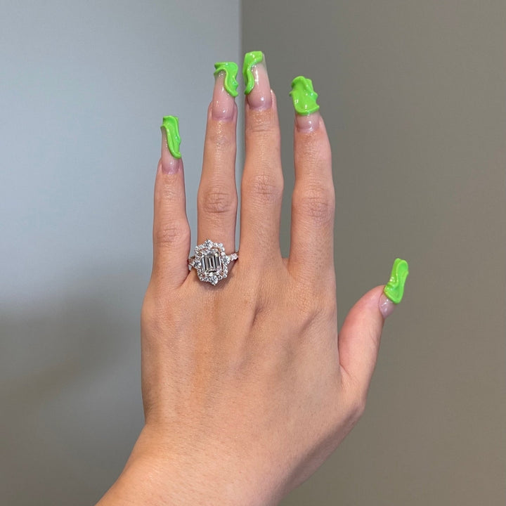 Emerald center stone halo ring round side diamond