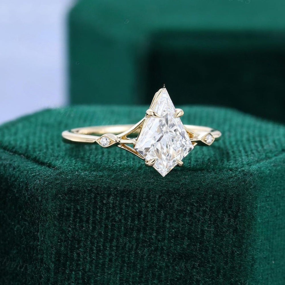 White diamond kite cut three stone ring