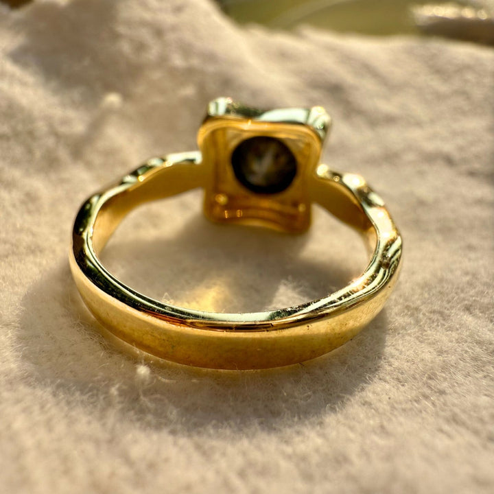Black round center diamond ring with white side stone
