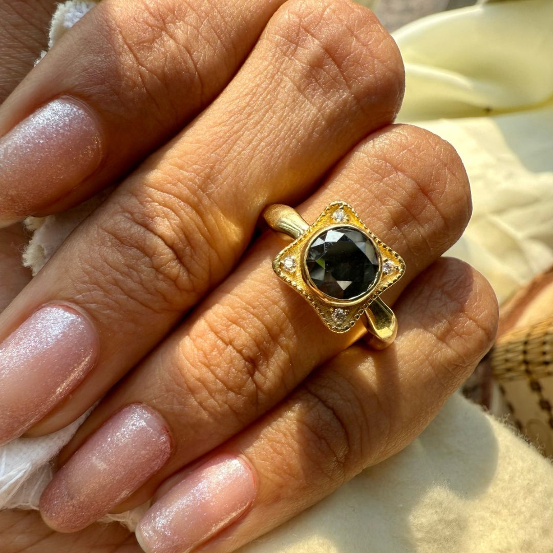 Black round ring with round side stone