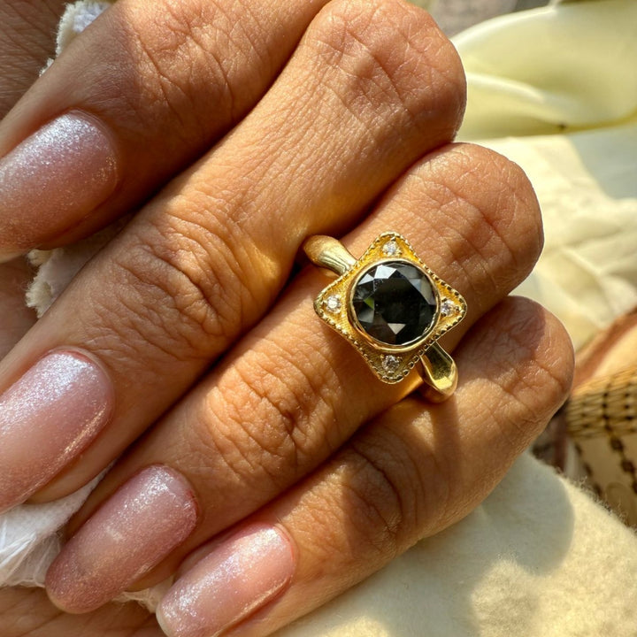 Black round ring with round side stone