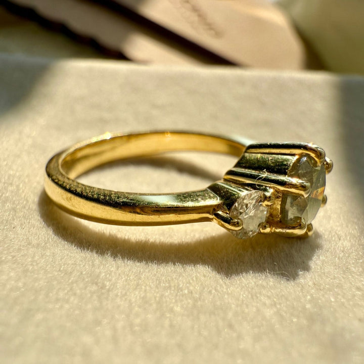 Yellow gold three stone ring