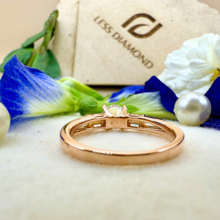 Three stone round baguette engagement ring