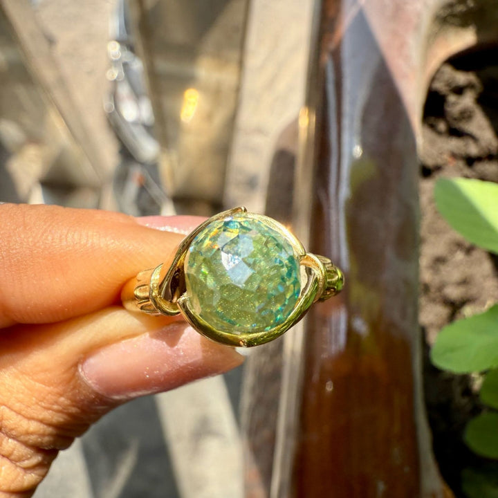 Green rose cut diamond ring with golden hand