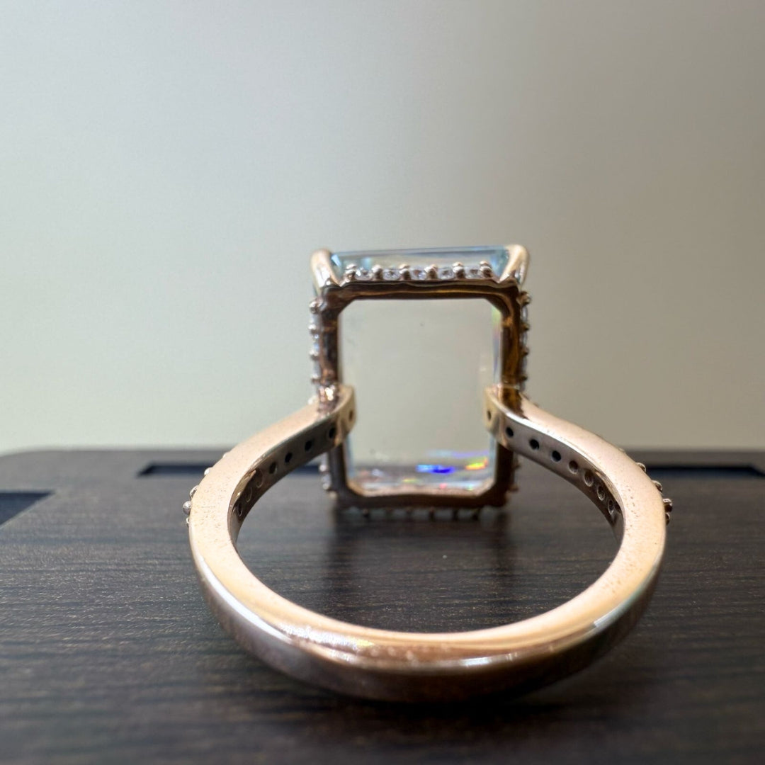 Emerald side stone diamond ring