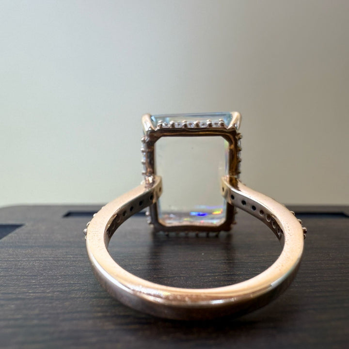 Emerald side stone diamond ring