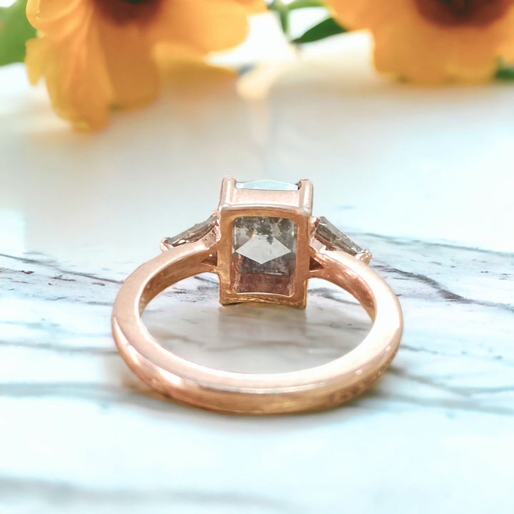 Cushion cut diamond ring with triangle side stone