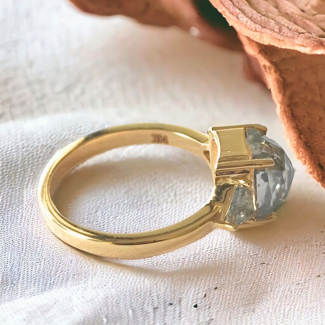 Radiant engagement ring triangle side stones