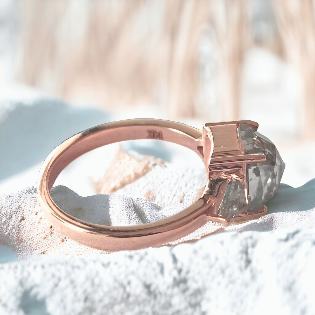 Three stone cushion ring with triangle side stones