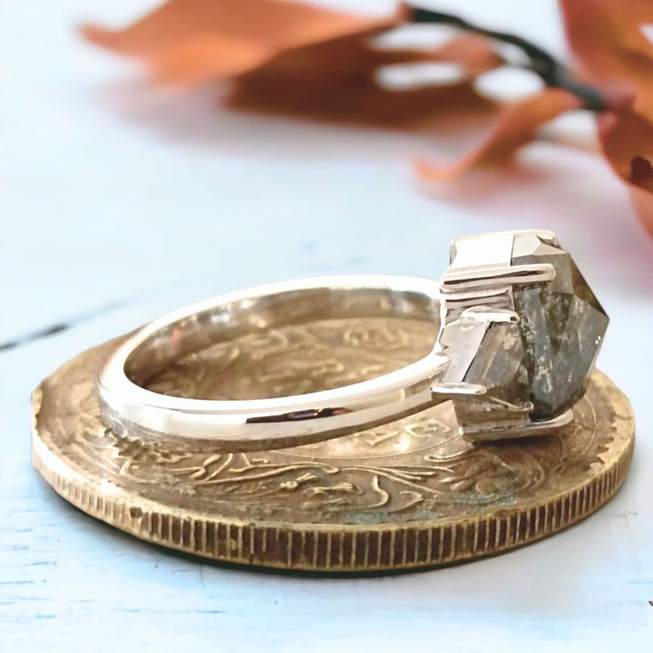 Radiant center stone with side stone ring