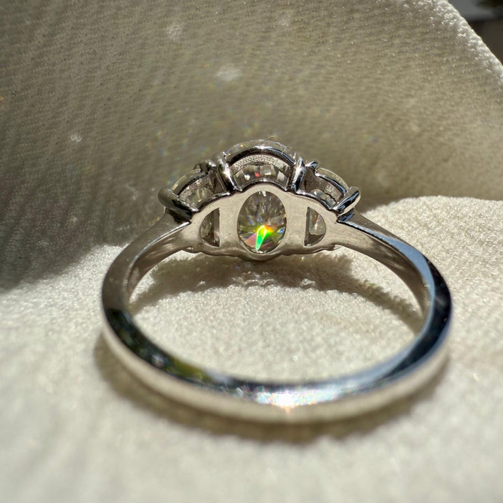 Half moon three stone diamond ring