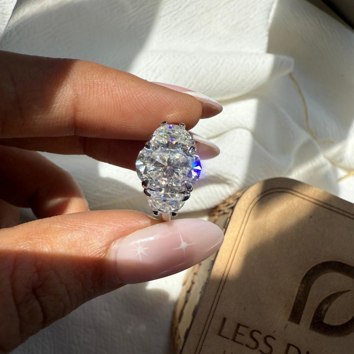 Three stone diamond ring with half moon accents