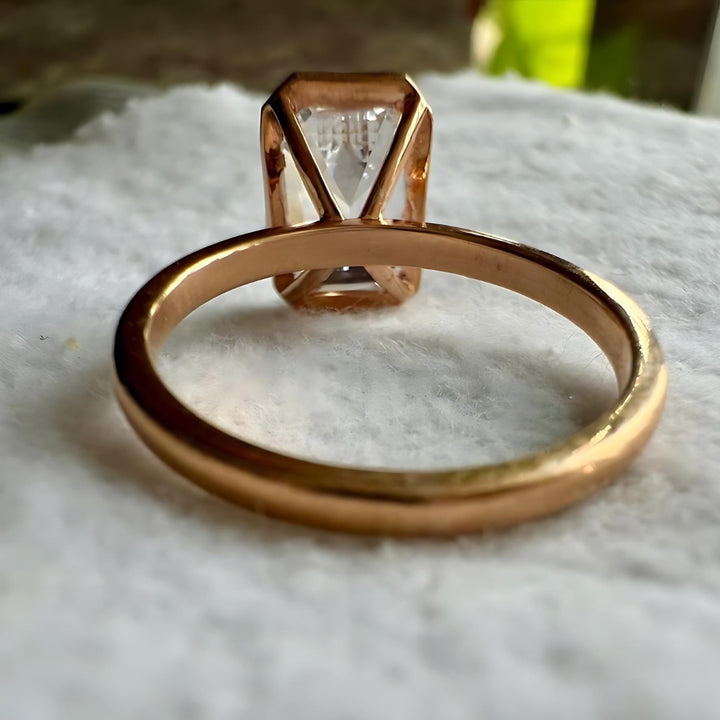 Step cut emerald ring